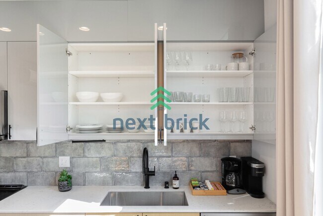 Building Photo - Offer: Unfurnished option available at $3,250, with an optional furnished package for an addition...