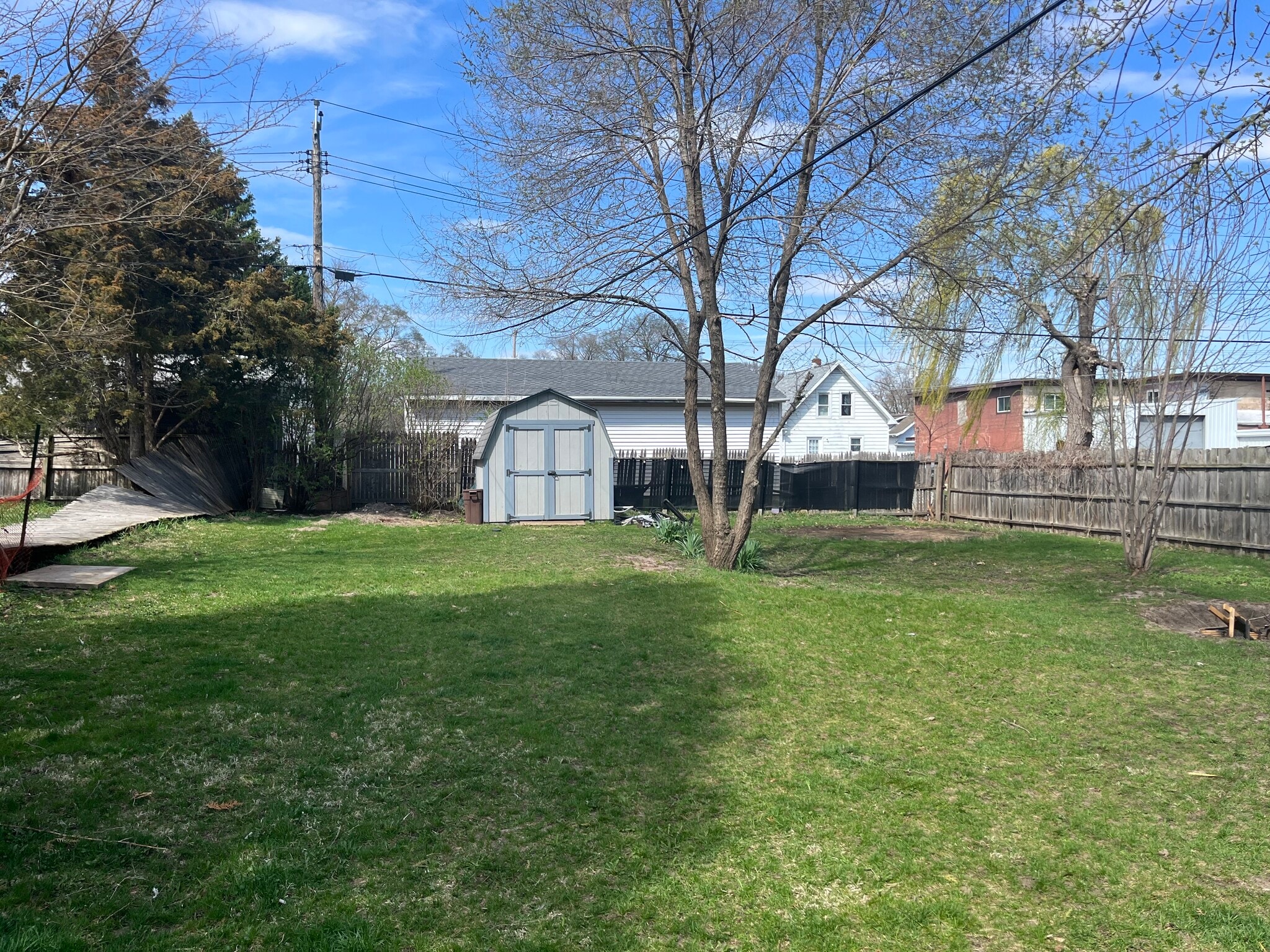 Large Partially Fenced Yard with Storage Shed - 1933 Forest Ave