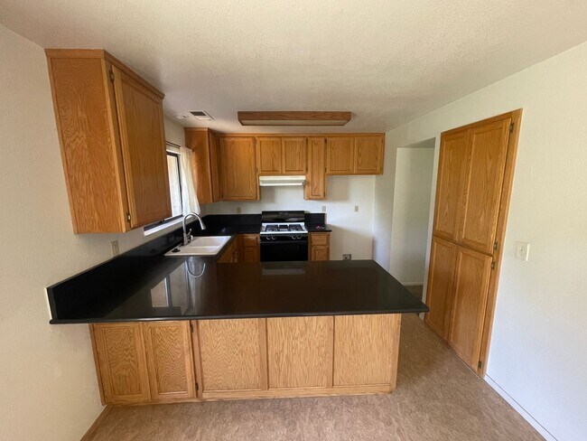 Building Photo - Central Chico, 3/2 fenced yard, 2 car garage, Gardener included, Solar, Fireplace, Craftsman Pergola