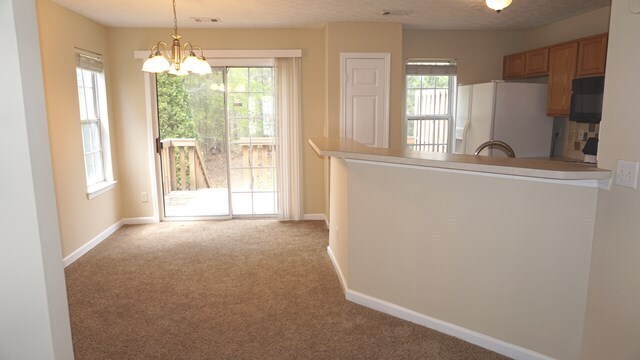 Building Photo - SUPER ADORABLE 2-Story, 2 Bedroom / 2.5 Bathroom Townhome!