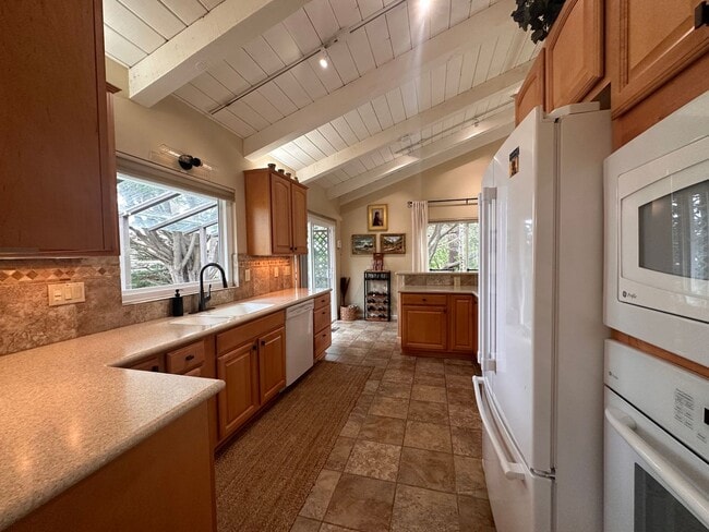 Building Photo - Sunny - Fully Furnished 2-Bedroom, with Office and 2 1/2 bathrooms.