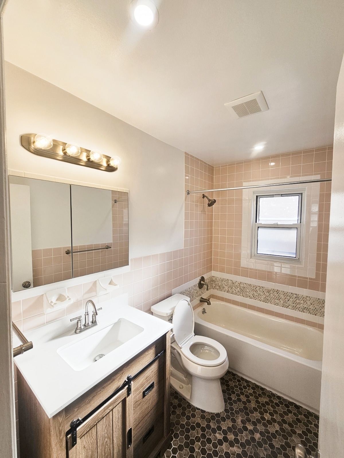 Newly renovated bathroom with light over vanity and ventilation system - 2050 Hazen St