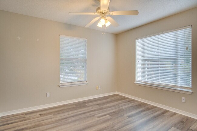 Building Photo - Live the Gulf Breeze Waterfront Life – Dock, Canal Access & Boat Lift!