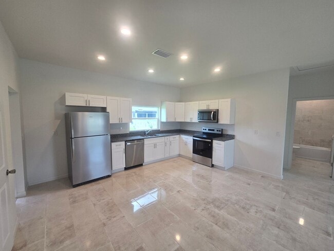 Building Photo - Brand New 3 BEDROOM 2 BATH AND ONE CAR GAR...