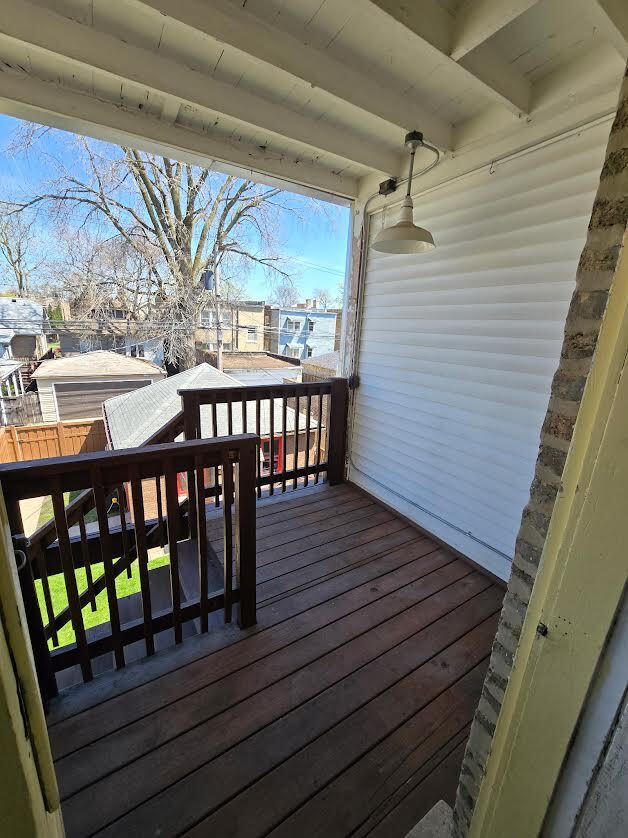 Cozy Back Porch holds small bistro set - 6621 N Campbell Ave