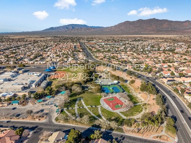 Building Photo - NW!! 4 Bedrooms!!! All Tile and Pergo flooring T/O!! NO Carpet!!! Low Maintenance Desert landscap...