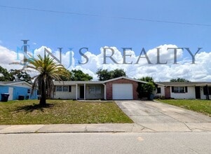 Building Photo - True 3 Bed~2 Bath~with garage. Over 1,000 sq ft, with updated kitchen & bathrooms, large open liv...