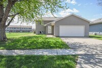 Building Photo - Updated 3BR Split-Level Home with Huge Deck, Fenced Yard & 2-Car Garage Near I-29!