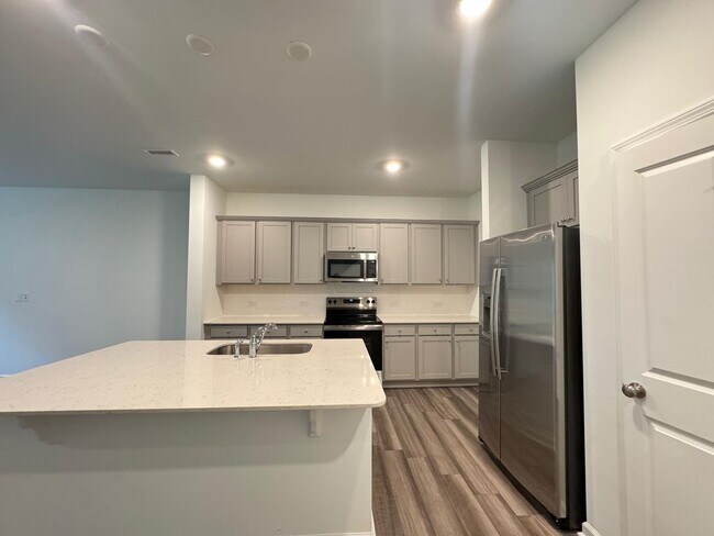 Building Photo - STUNNING BRAND-NEW TOWNHOUSE in a very con...