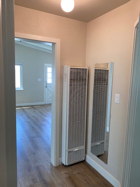 Hall area that enters into both bedrooms. Wall heater and full length mirror in hall. - 210 30th St