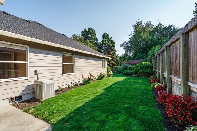 Building Photo - Beautifully Landscaped 1/4 acre with Well Maintained 4 bedroom 2 Bath Home with 3 Car Garage