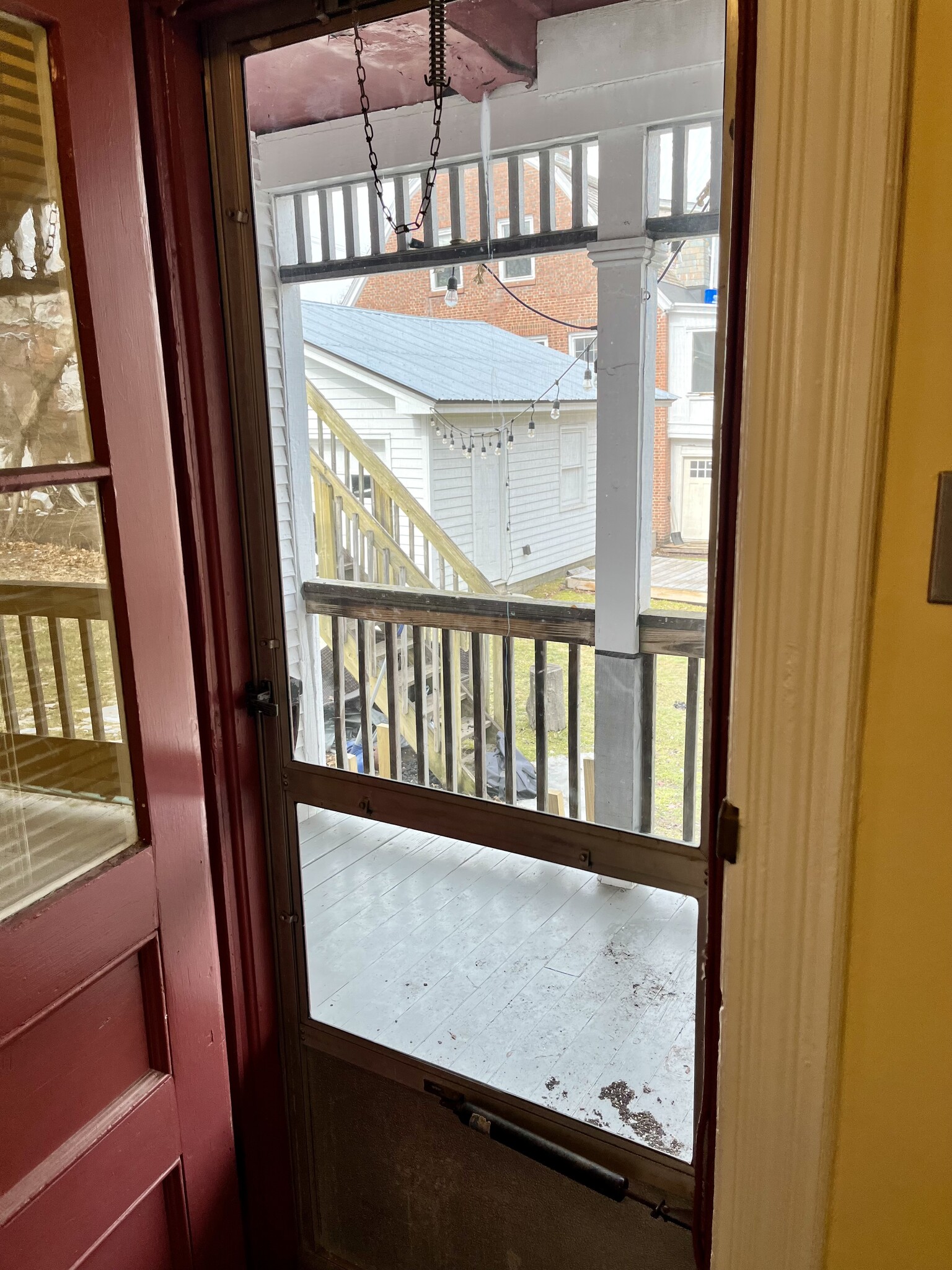 Door to covered porch. Backdoor is located in hallway with bathroom/laundry. - 114 Buell St
