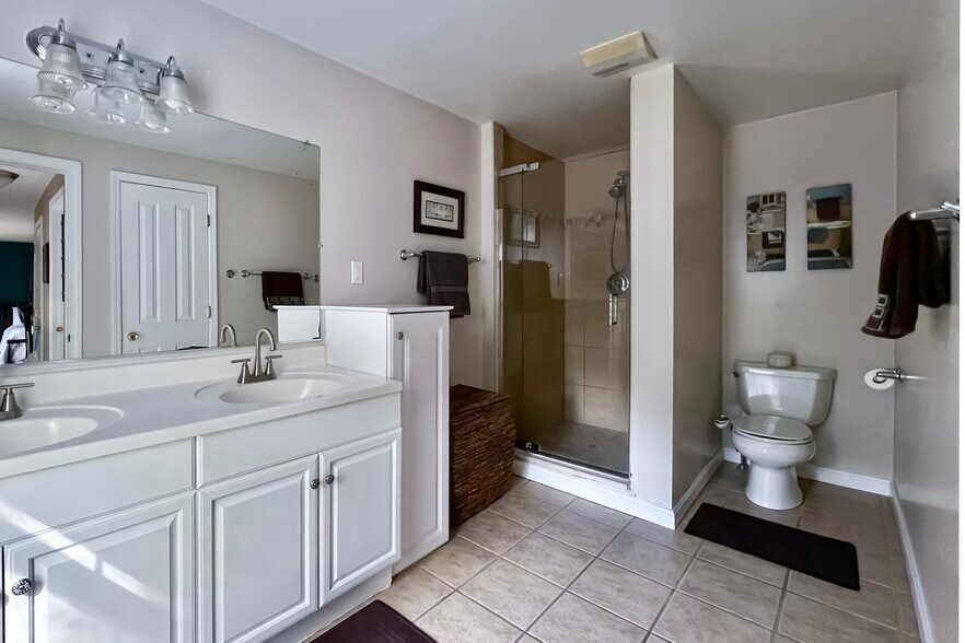Master bathroom with double sink and tiled walk-in shower - 278 Harrison St