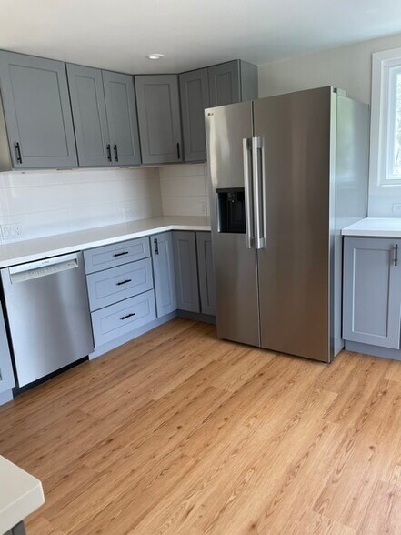 Kitchen is totally renovated with all new cabinets, appliances, flooring, side-by-side refrigerator. - 101 Granlee Rd