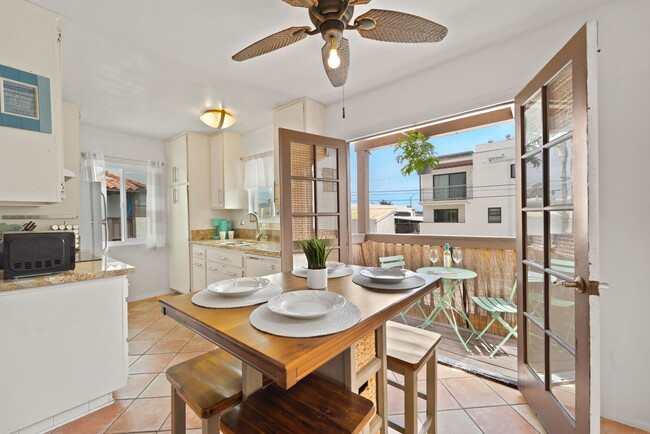Dining table to south facing balcony - 709 Agate St