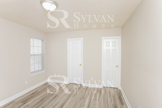 Building Photo - Welcome to this beautiful and sun-filled 3...