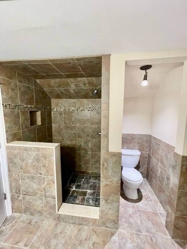 Building Photo - Introducing WesleyHeights401, a charming 3...