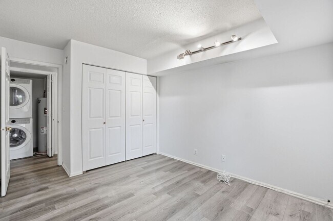 Building Photo - This expansive ground level residence is set within a serene, gated garden community surrounded b...