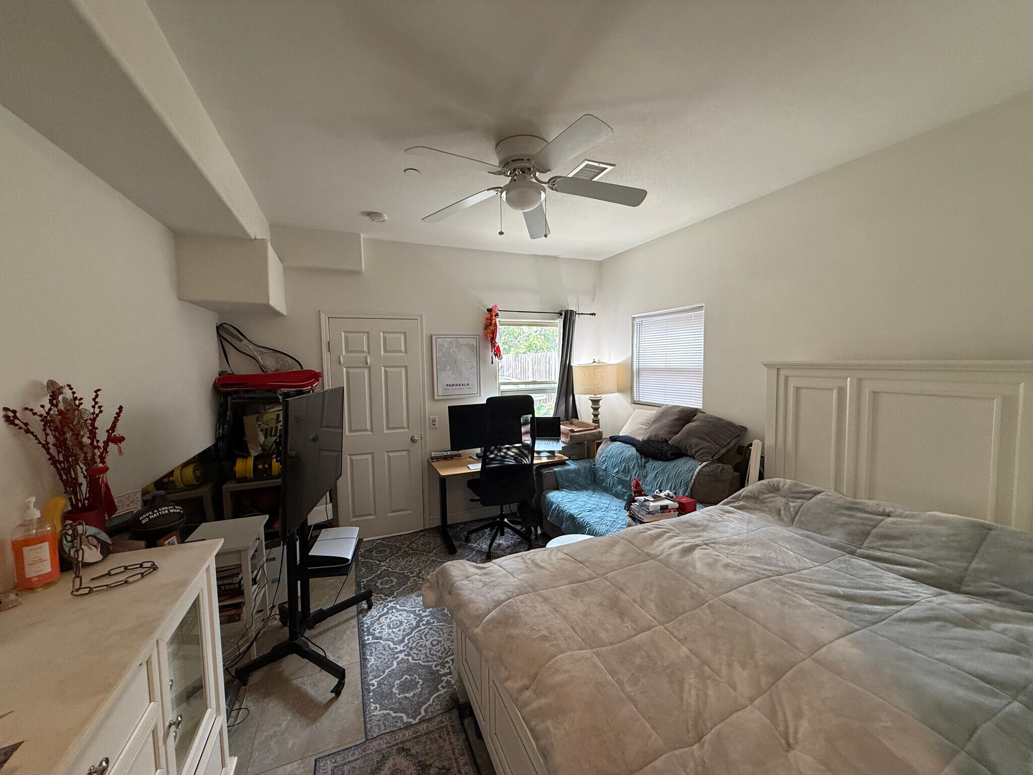 same living room/bedroom room but with a small couch and queen bed - 24381 Santa Clara Ave