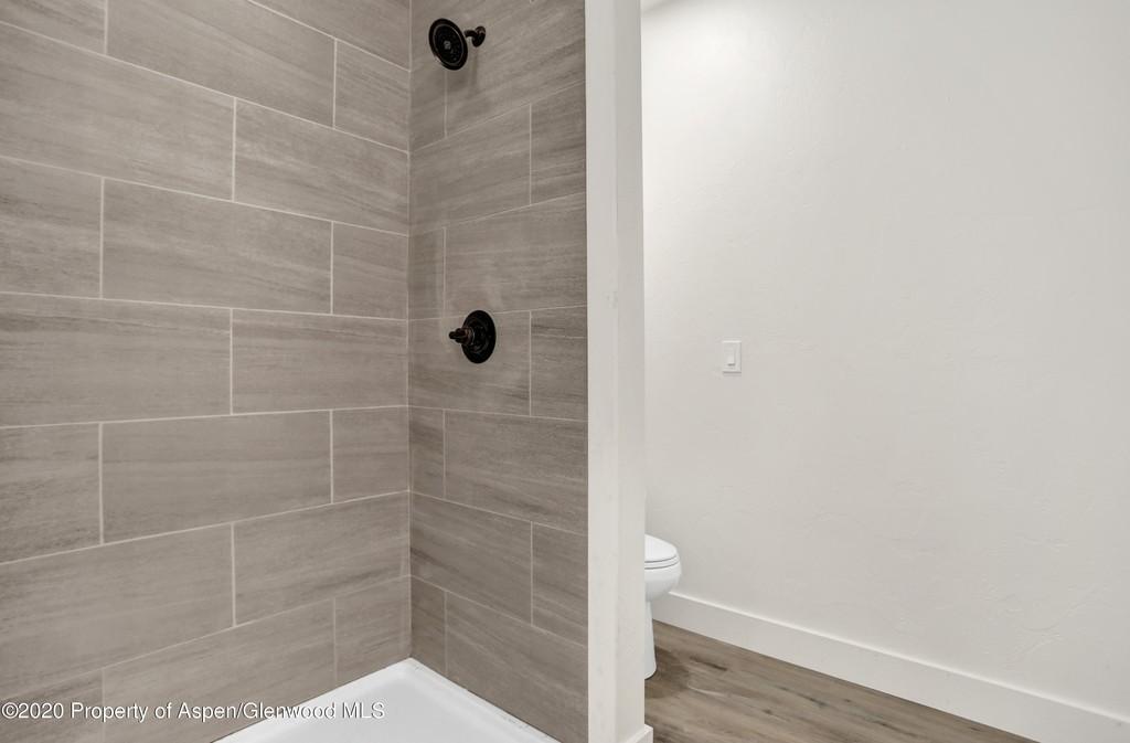 Master bathroom showing shower and separate toilet area - 340 Lake View Rd