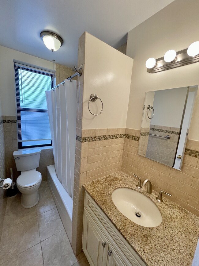 Updated bathroom; granite countertop - 210 Martine Ave