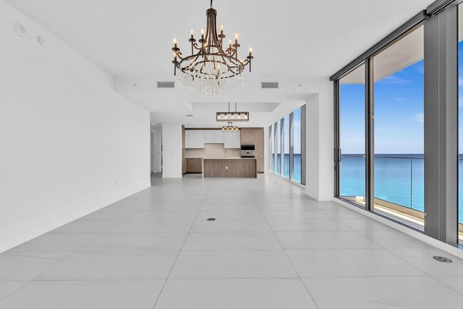 Building Photo - Stunning High-Rise Condo with Ocean Views | Prime Beach Location