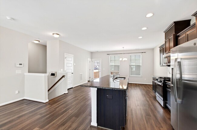 Building Photo - Beautiful 4BR End-Unit Townhome in Prime Apex Location!