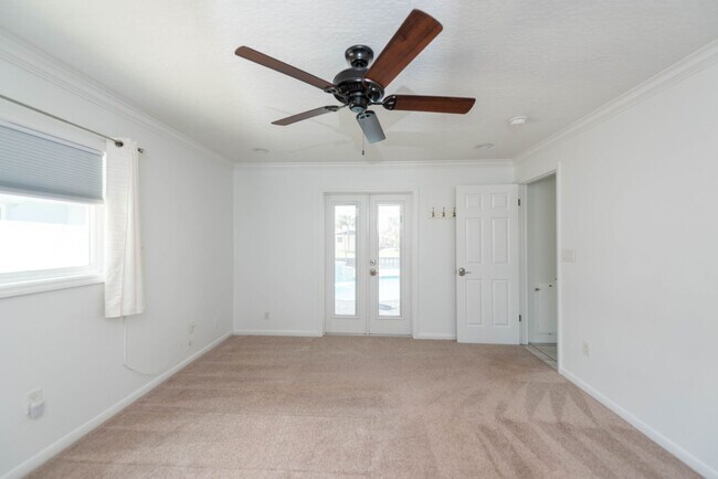Building Photo - Live the ultimate Space Coast waterfront lifestyle at this stunning beachside canal home in Satel...