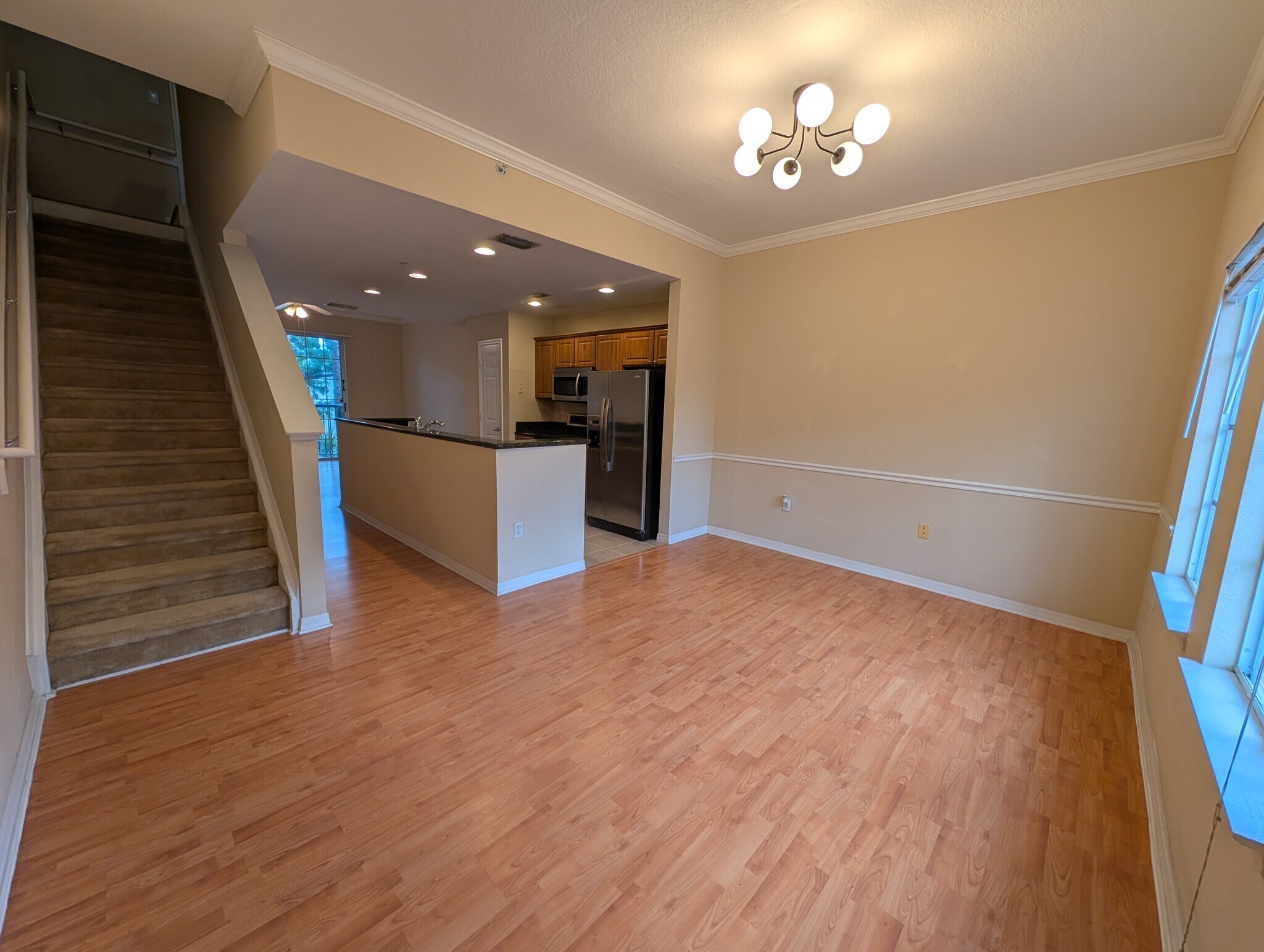 Dining room with stairs leading up to bedrooms - 5218 Hampton Beach Pl