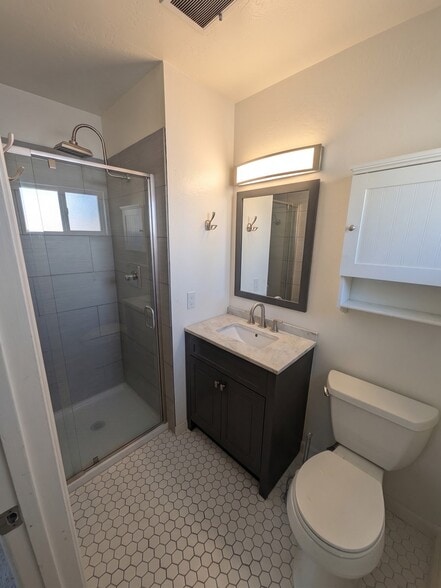Primary bathroom with stand-up shower. - 3006 Campbell Pl