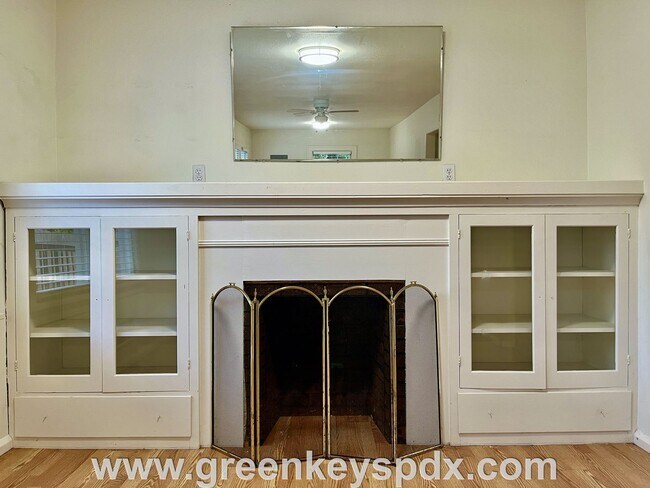 Building Photo - This 3-bedroom 1-bathroom house has a large front yard and a mostly fenced backyard.