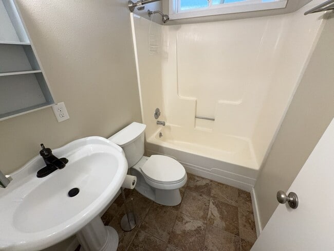 Building Photo - Newley updated 3-bedroom home features fenced yard, garage, and covered patios!