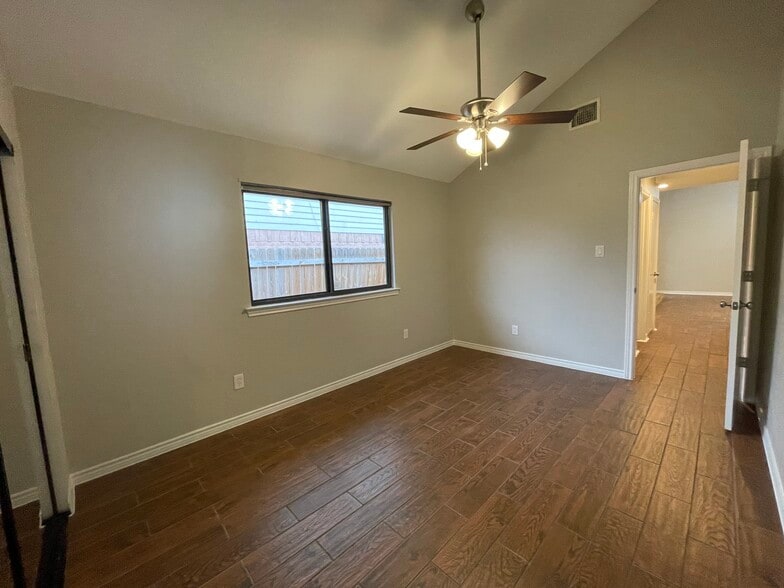 Large guest bedroom! features vaulted ceiling and new ceiling fan along with wood look tile floors! - 812 Via Madonna