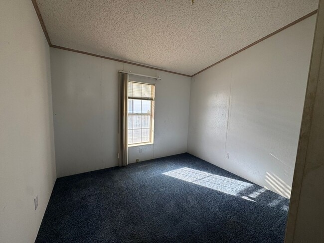 Building Photo - Sunrise Vista -2 Br, 2Ba home with covered carport, fenced yard, storage