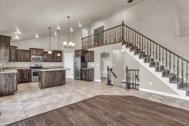 Building Photo - Spacious Syracuse Home with Covered Deck, Loft & Oversized 3-Car Garage