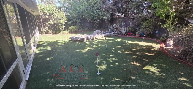 Building Photo - 3 Bed | 2 Bath Home with Office, Sunroom, Outdoor Kitchen & Backyard Oasis