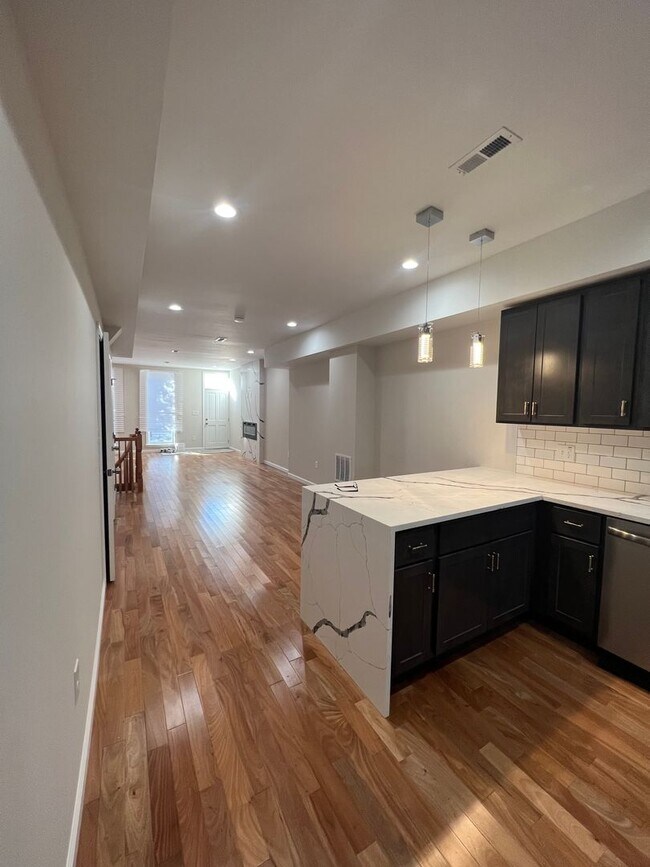 Building Photo - East District 3 BR/3.5 BA End Row Home w-Private Parking