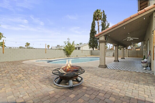 Building Photo - Welcome to your entertainers dream home with solar and pool service included!