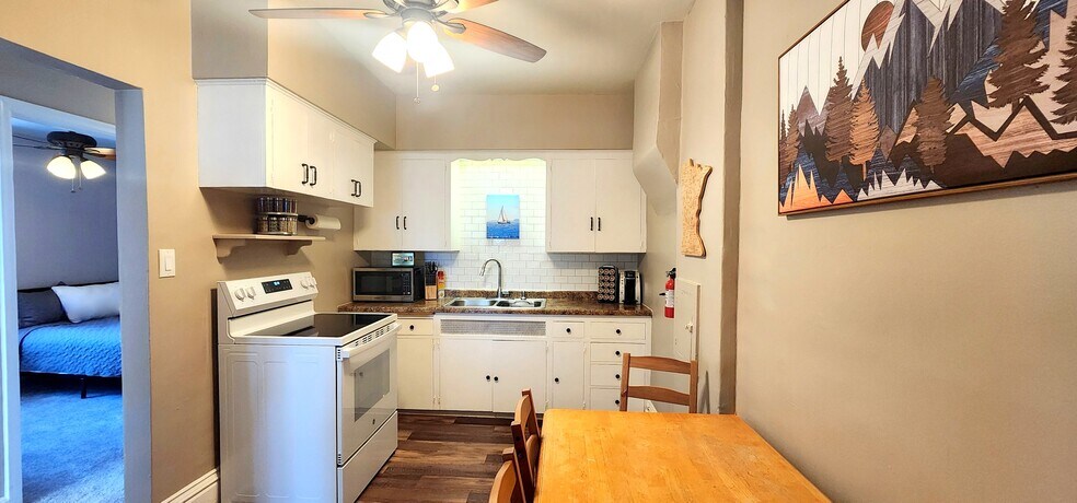 Your fully stocked kitchen—perfect for coffee breaks or late-night cravings. - 822 E 4th St