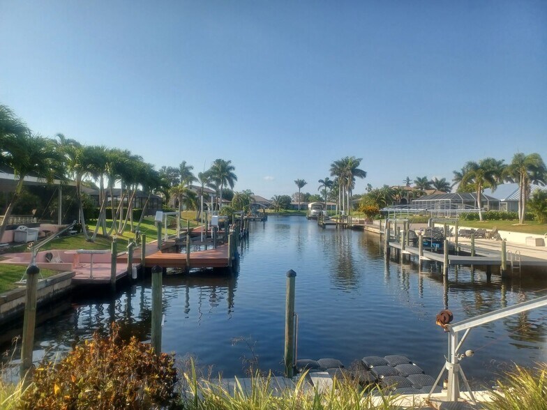 Building Photo - COMING SOON: Spacious Gulf Access 3 BR / 3 BA Home With a Large Screened Lanai for Entertaining &...