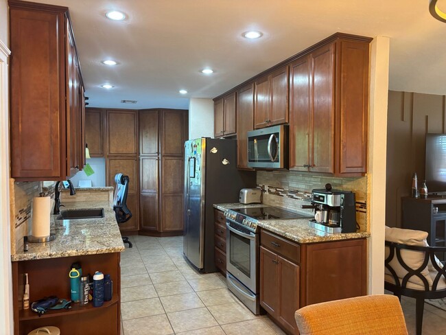 Building Photo - Welcome to this stunning updated 2-bedroom, 2-bathroom home on a lake located in the vibrant comm...