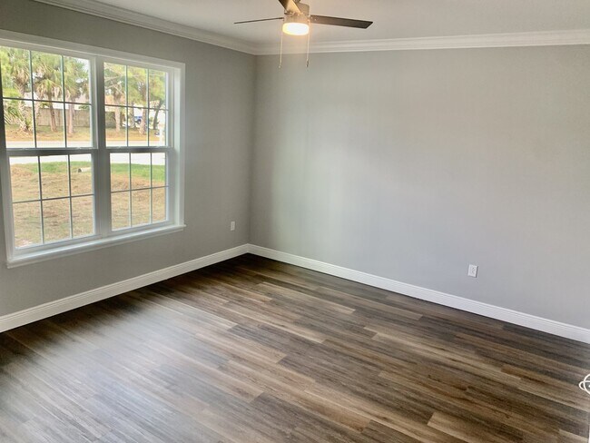 Building Photo - "Spacious 4-Bedroom 3-Bath with In-Law Suite & Granite Finishes in Palm Bay!"
