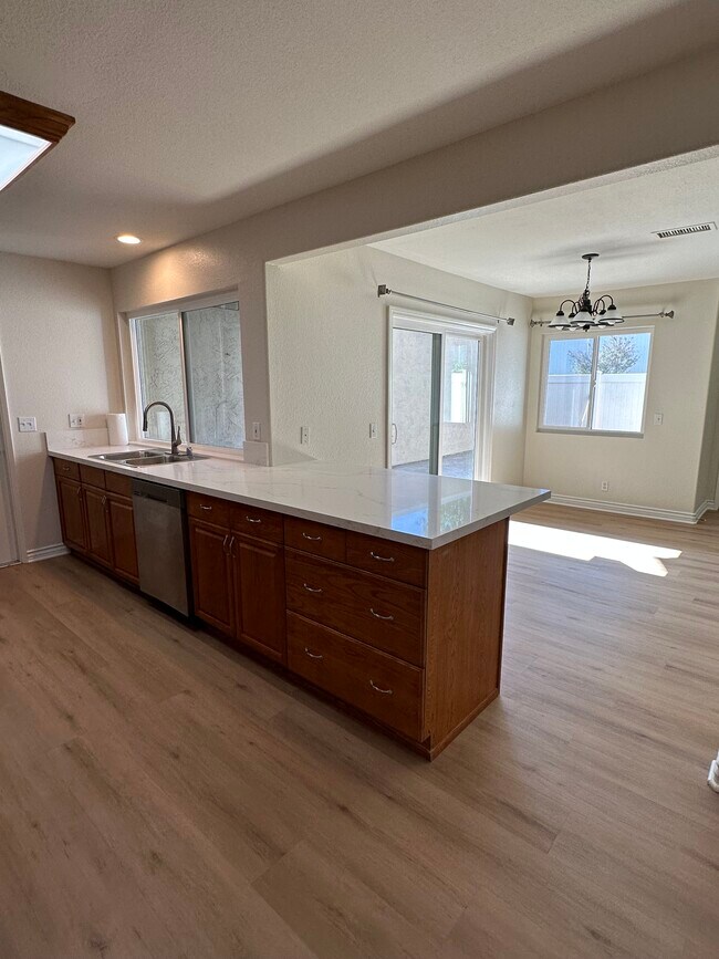View from Kitchen to nook area - 13784 Sycamore Tree Ln
