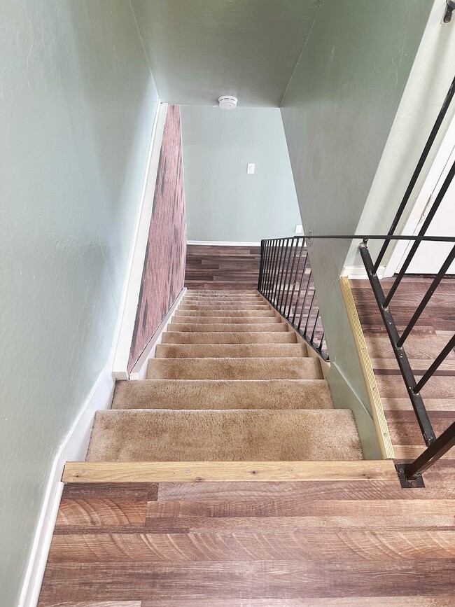 Stairs from bed and bath upper floor to the first floor living area - 5494 Judith St