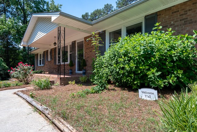 Building Photo - Classic brick rancher with carport and updated decor