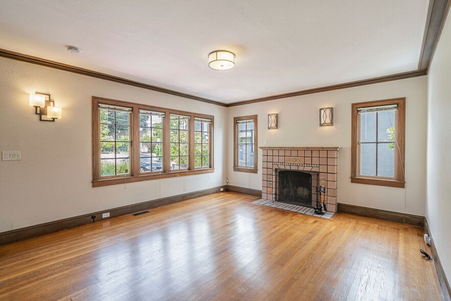 Main living room with original fireplace - 1360 Hopkins St