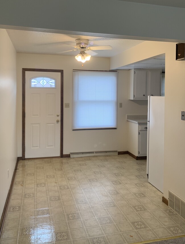 Eat in kitchen, exterior door opening to parking lot. - 1320 5th St W