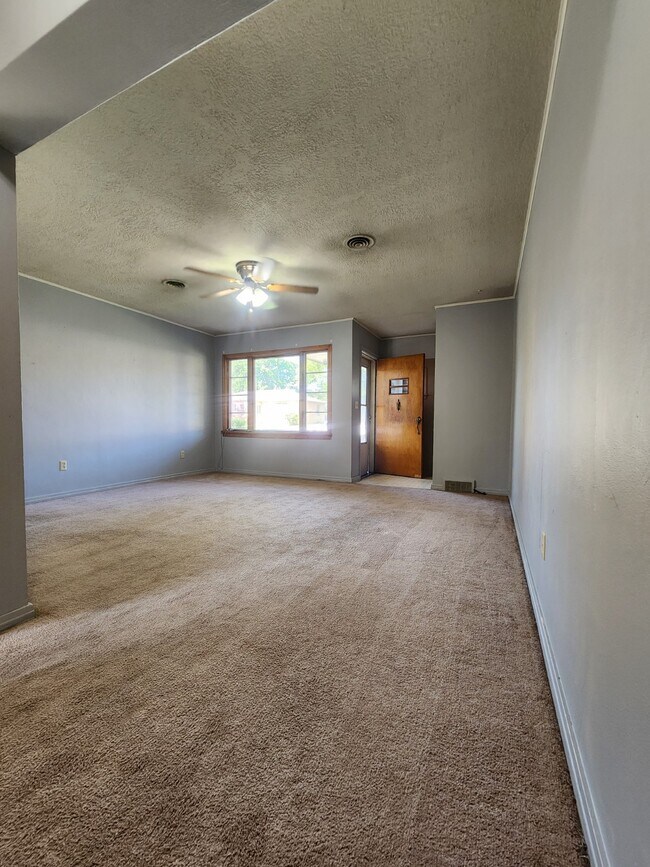 Entry door and living room - 813 East Ave S