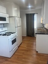 Kitchen w gas range dual stainless sink & refrigerator - 4023 McLaughlin Ave