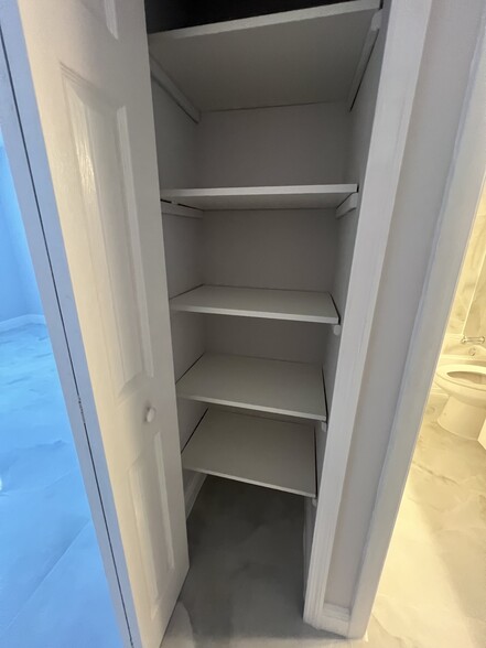 Hallway closet with new shelving - 1060 NW 80th Ave